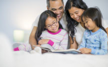 parents and children reading in bed