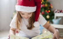 girl reading a christmas book