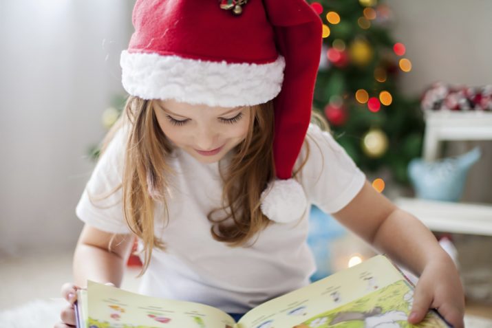 girl reading a christmas book