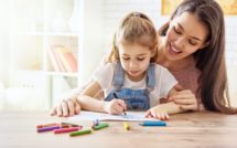 mother and daughter coloring together