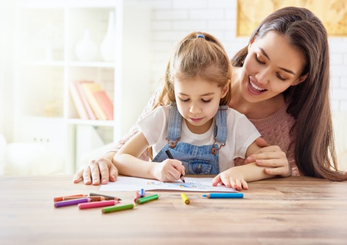 mother and daughter coloring together