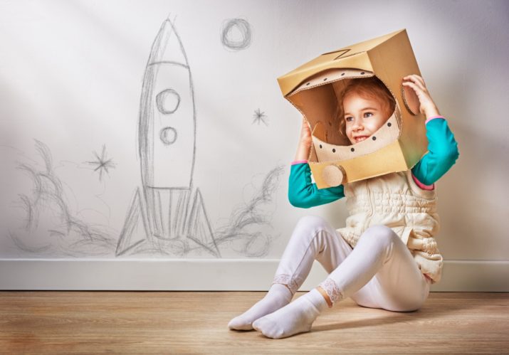 child is dressed in an astronaut costume